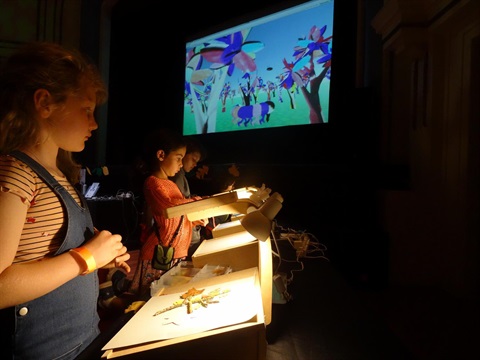 Image of children on animation stations