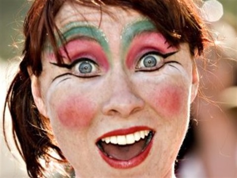 Image of a surprised woman with theatrical make-up on 